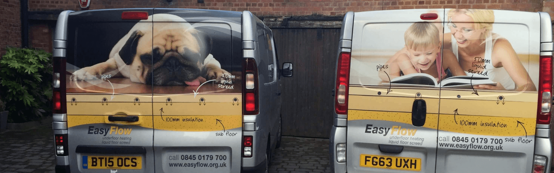 Two vans parked at a home where underfloor heating for wooden flooring is being installed