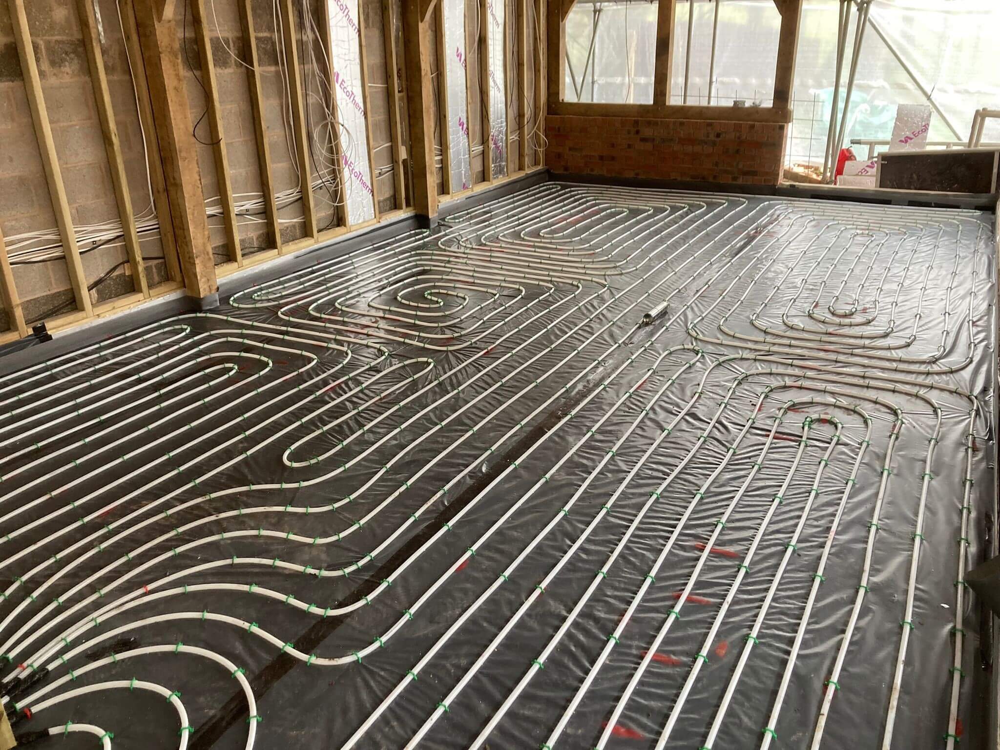 Networks of heated flooring pipes laid before floor screeding takes place