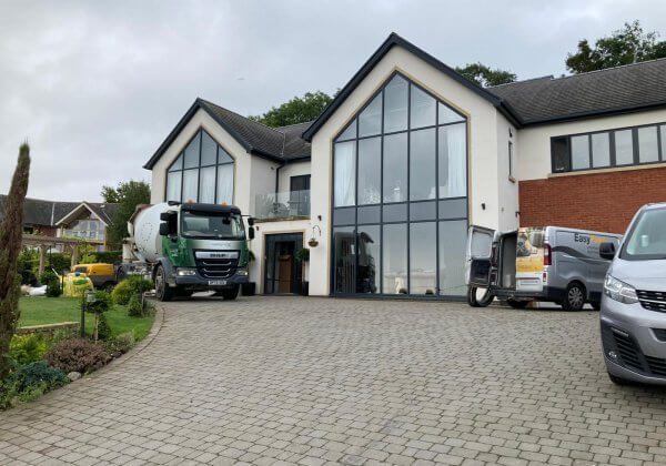 Heated flooring and floor screeding team visiting property in Wrexham