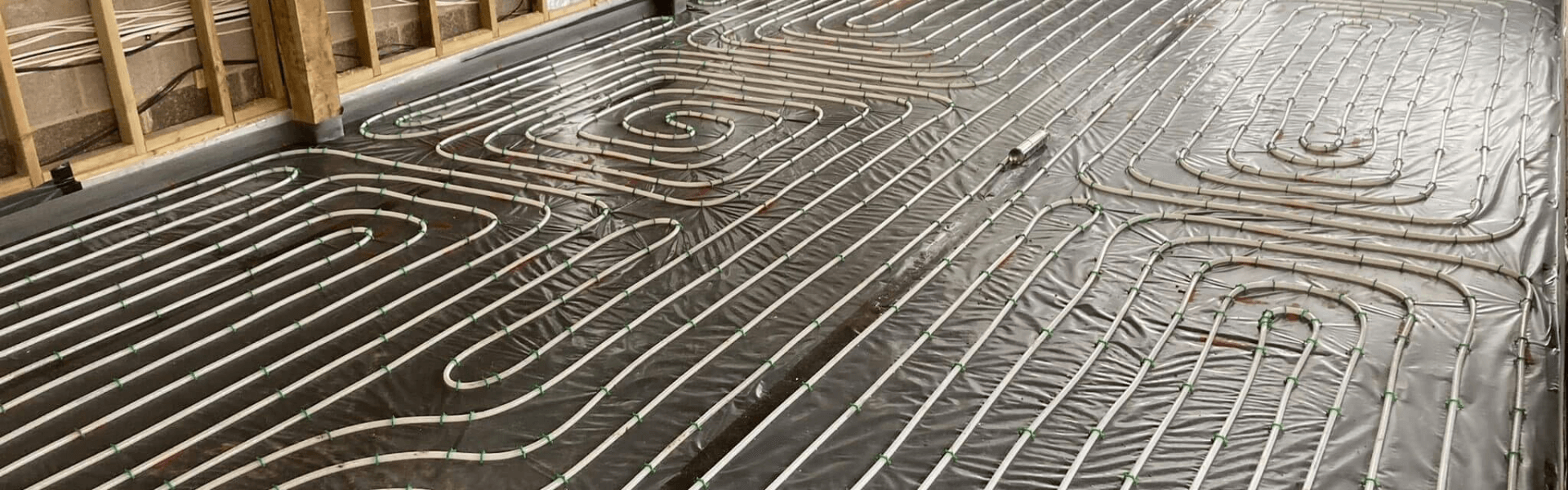 Networks of heated flooring pipes laid before floor screeding takes place