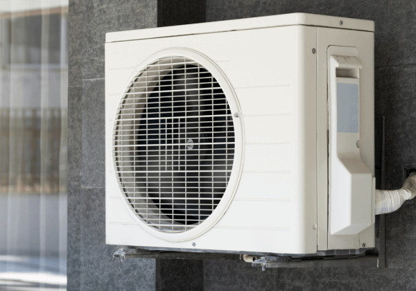A heat pump installed outside a small business