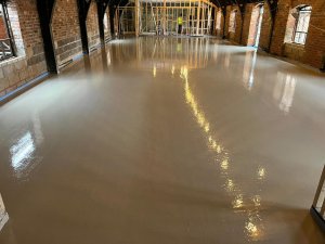 Underfloor heating covered with concrete screed in a brewery