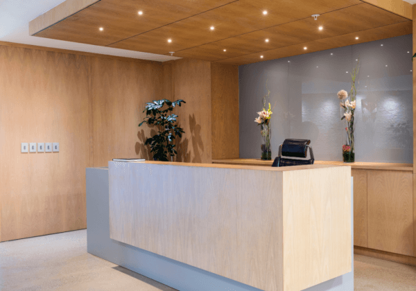 A spa reception desk and tiled floor that covers underfloor heating