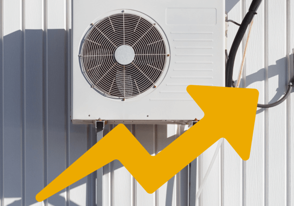 A commercial heat pump installed outside a warehouse