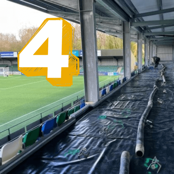Liquid screed being poured at a football club