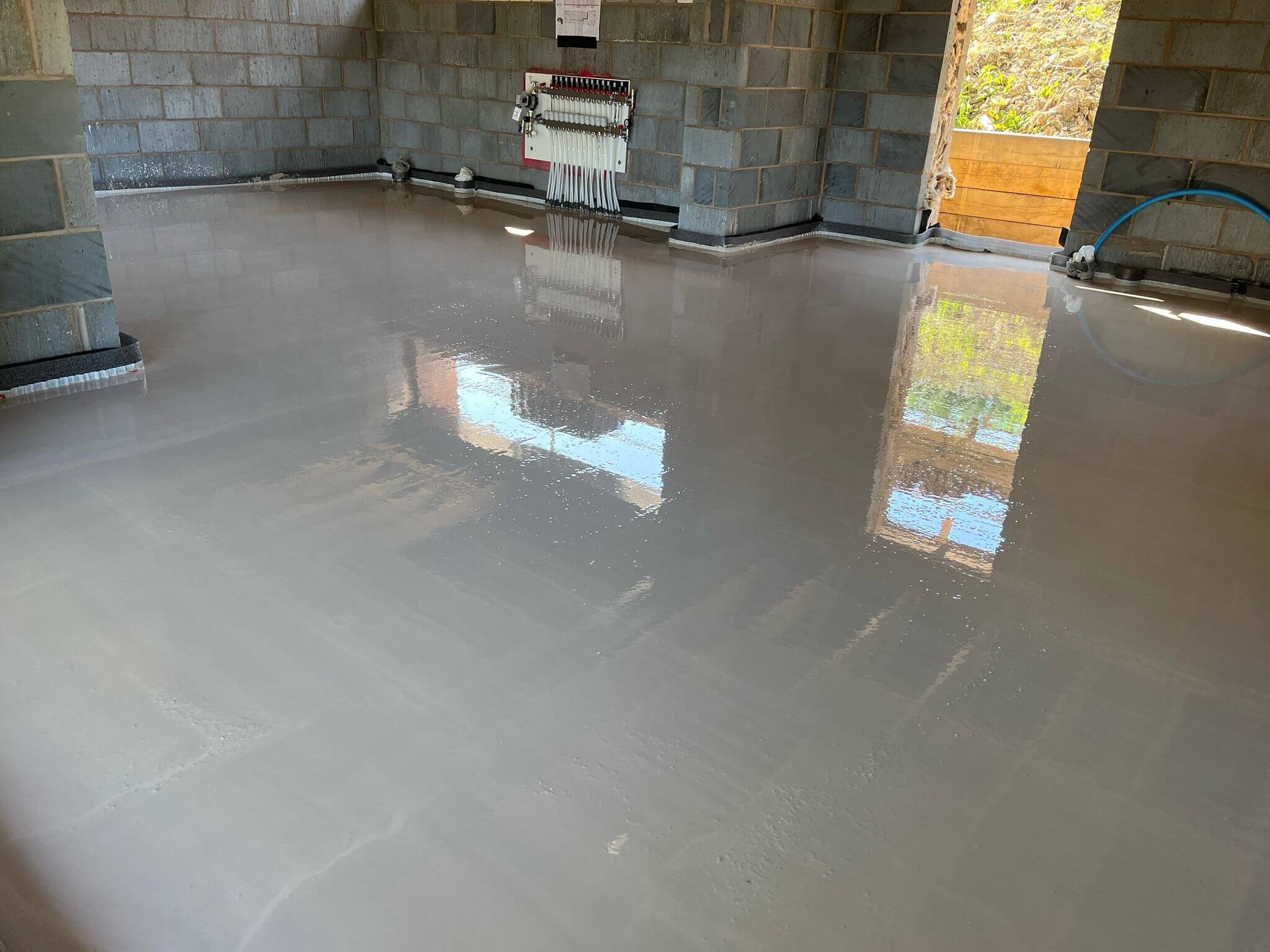 Freshly laid liquid screed