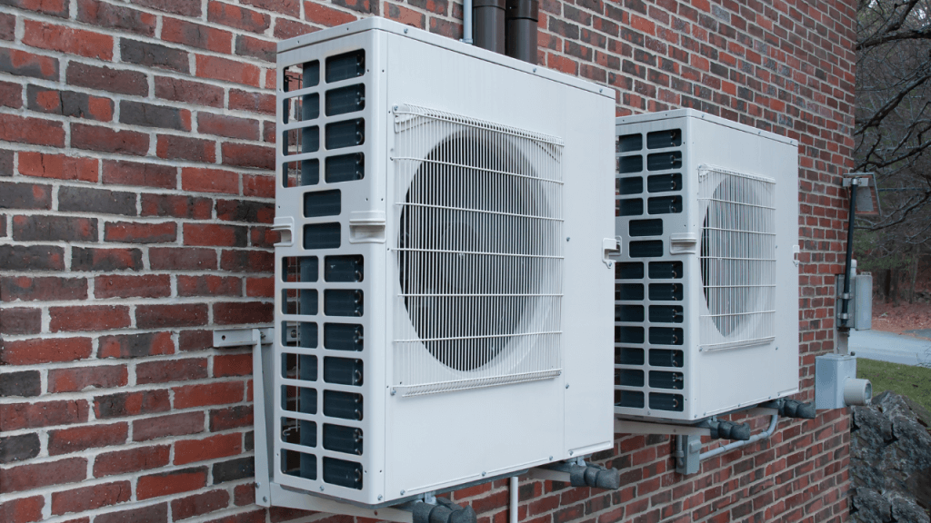 Two air source heat pumps running side by side