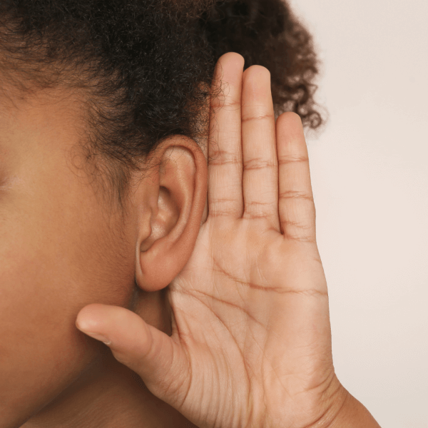 Person listening to the sound of a heat pump