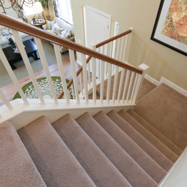 A flight of stairs with underfloor heating installed above and below it