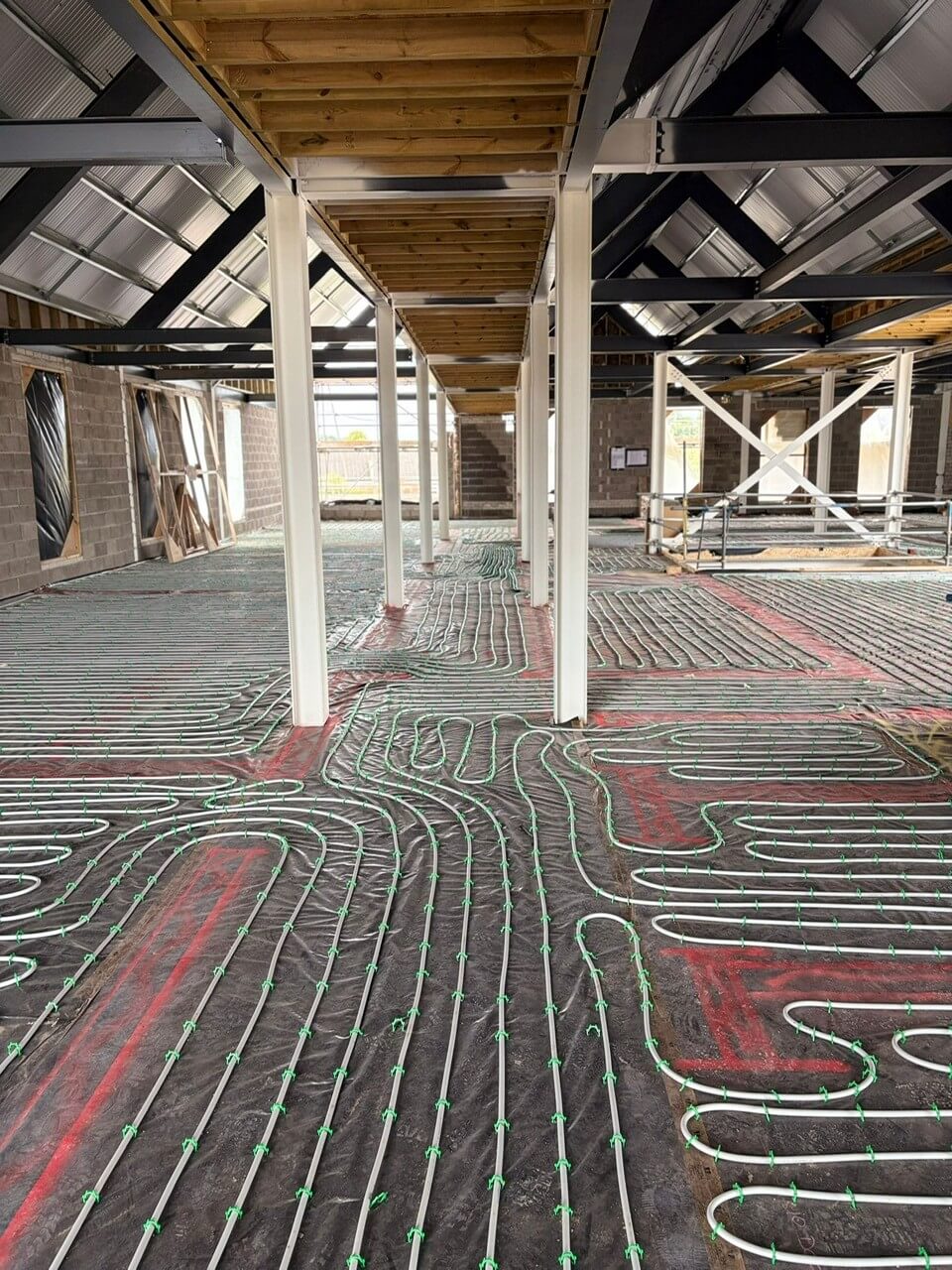 Detailed view of underfloor heating zones designed for balanced temperature control across large commercial areas