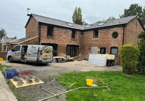 Underfloor heating installer van outside a property