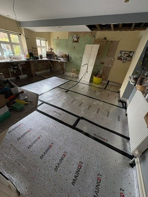 Insulation for underfloor heating pipework in kitchen
