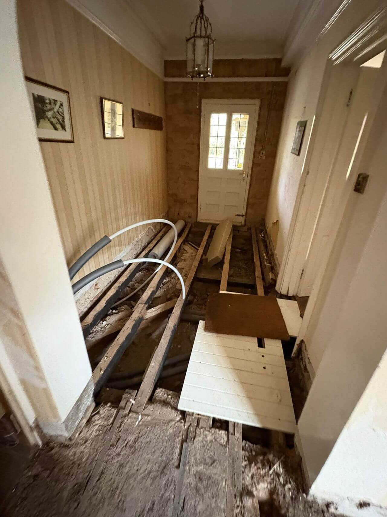 A hallway that has been prepped by an underfloor heating installer