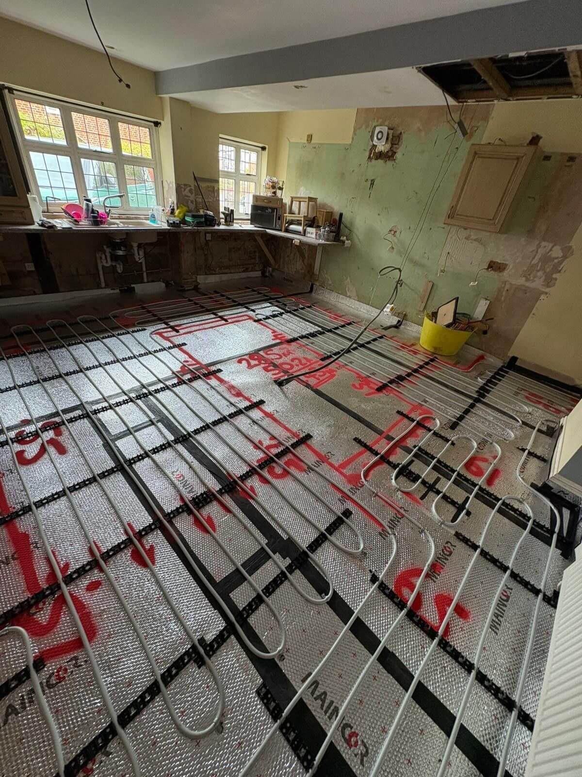Underfloor heating installation in domestic kitchen